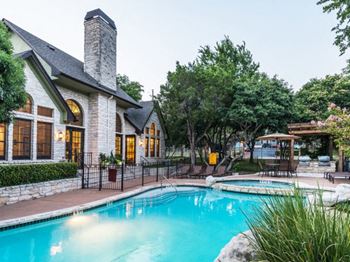 a house with a swimming pool in front of it